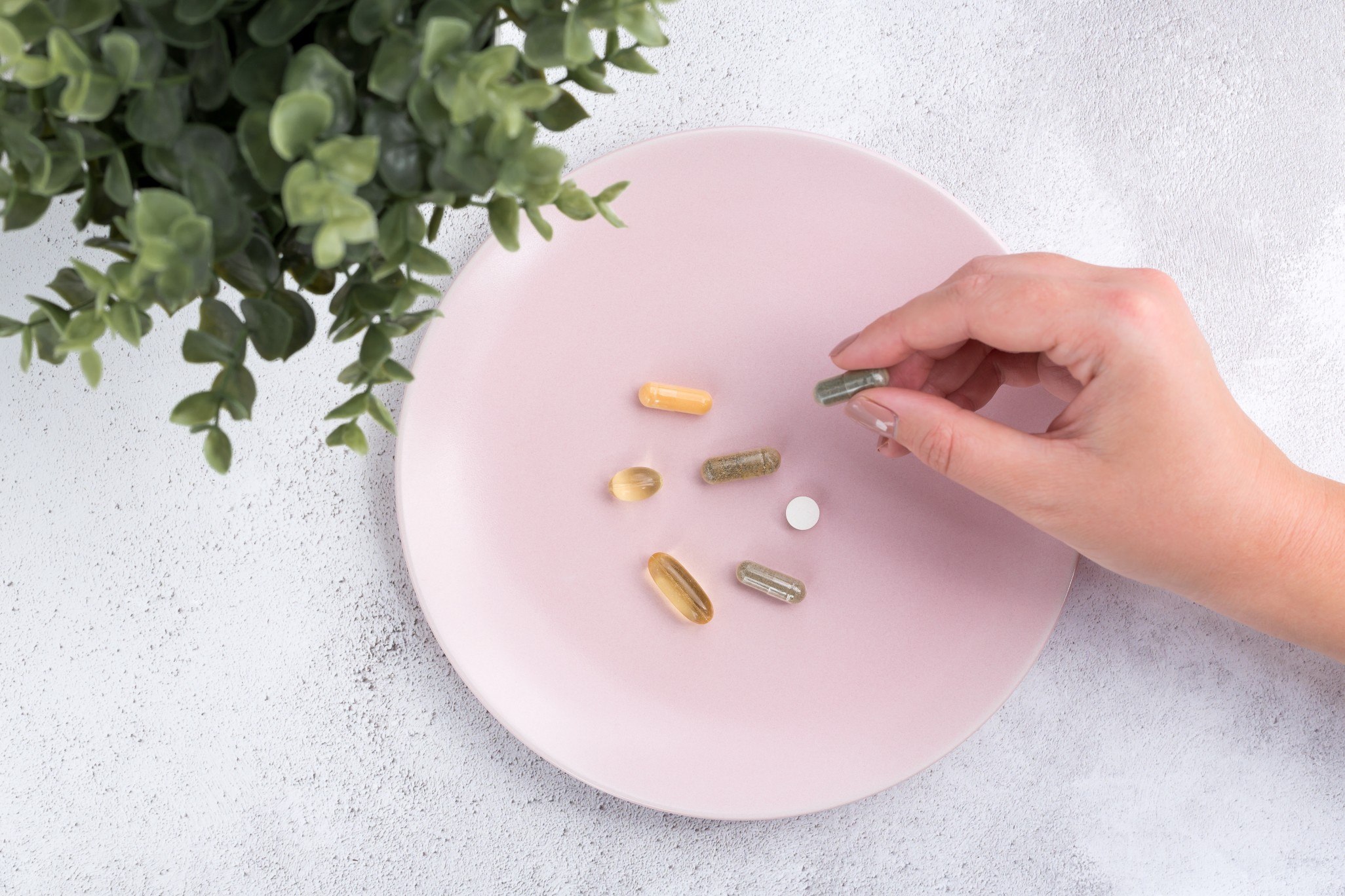 pills on pink plate